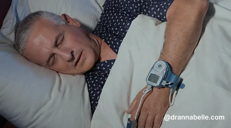 Man sleeping during a sleep study with a pulse oximeter